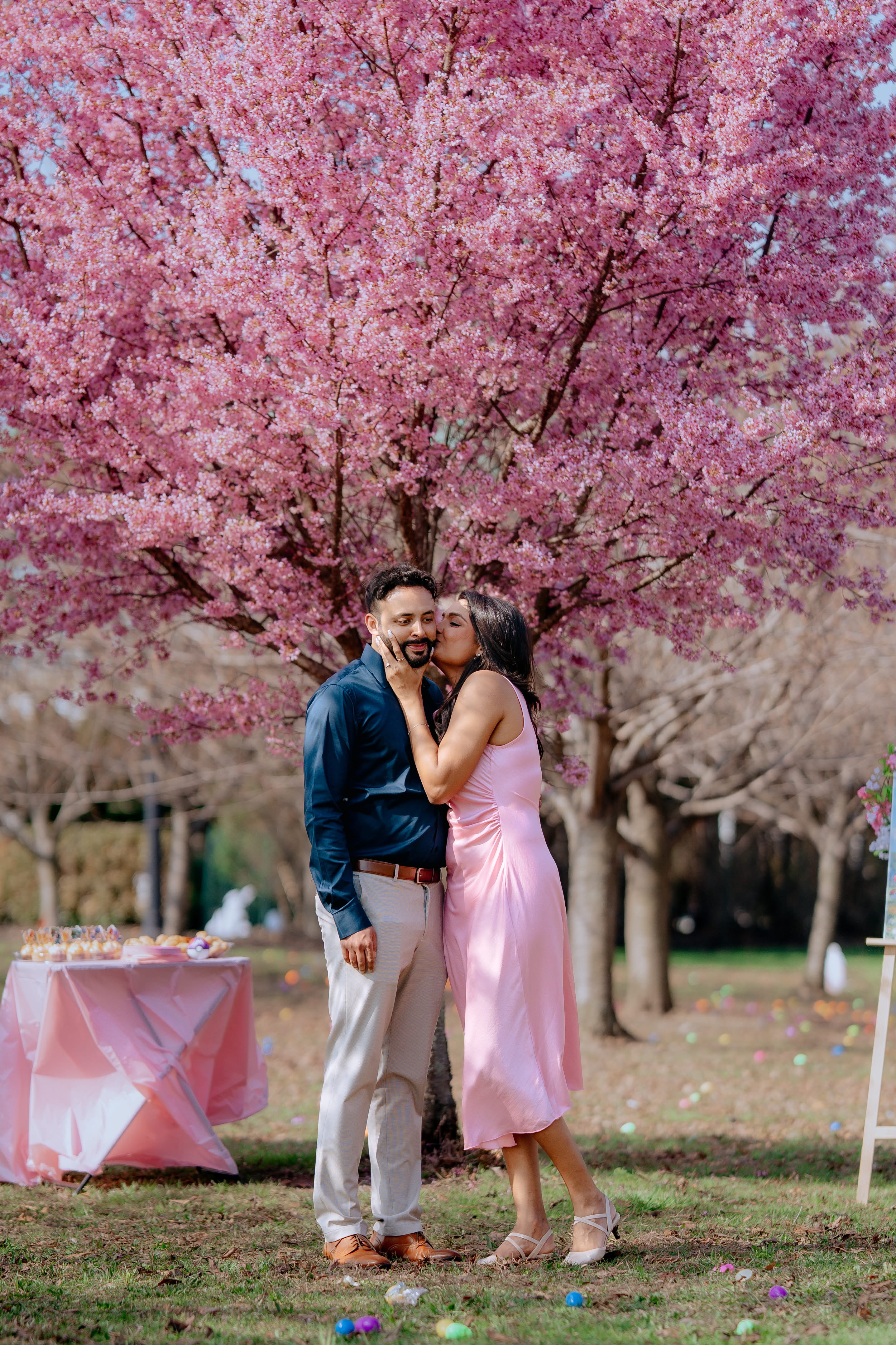 Kareena kissing Arvin under a blooming cherry blossom tree